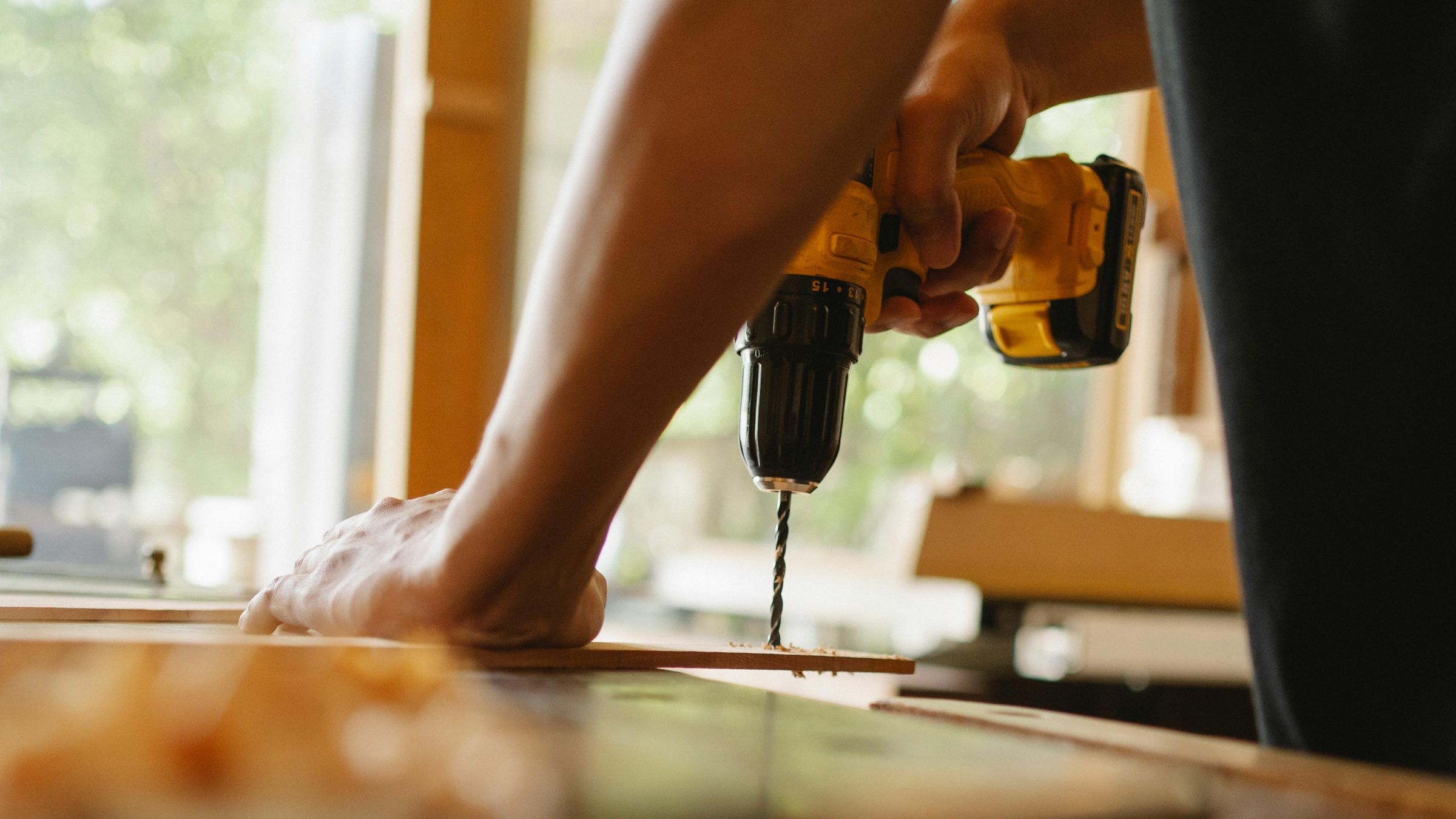 Carpenter carrying out repair work on timber joinery